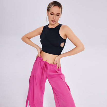 Woman practicing yoga in a breathable workout tank top, offering flexibility and comfort for various poses.